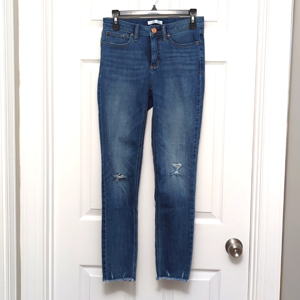Lauren Conrad women's jeans size 8. Skinny cutoff jeans with holes in knees.